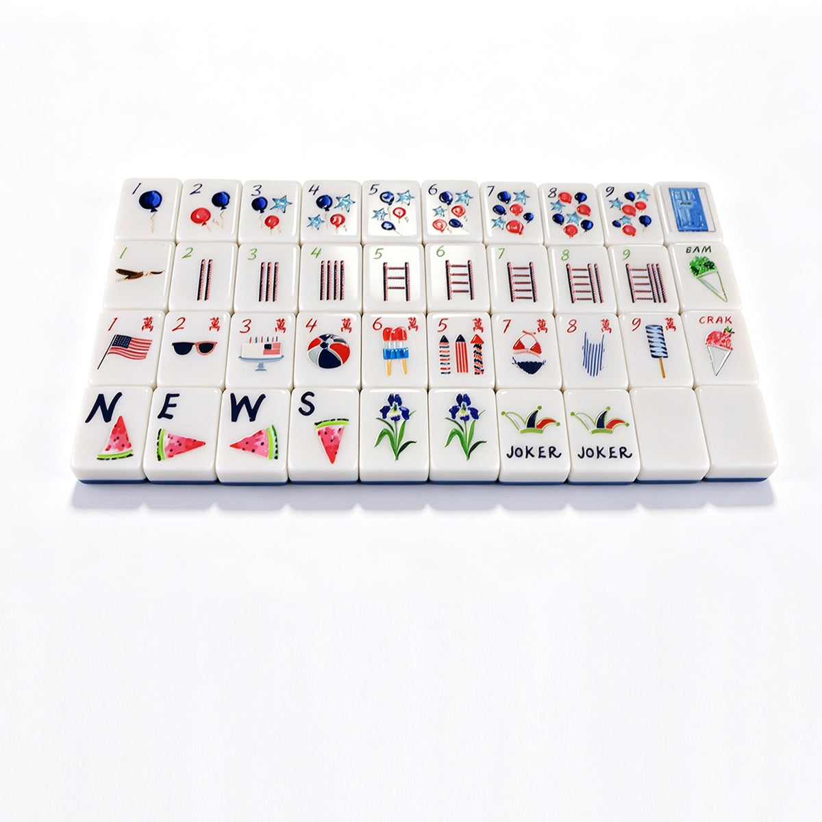 A set of white mahjong tiles arranged in a grid on a clean white background. The tiles feature various symbols, numbers, and illustrations including hearts, bars, ladders, flags, flowers, watermelon slices, and the words 'JOKER'.
