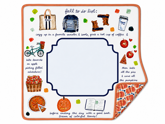 Happy Fall reversible mahjong mat with autumn illustrations, an orange border, a pale blue center, and a folded corner showing the pumpkin-patterned reverse.
